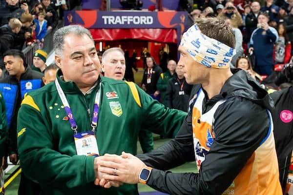 Kevin Sinfield, right, is congratulated by Australia rugby league boss Mal Meninga after after his seven ultra- marathons. Picture by Allan McKenzie/SWpix.com.