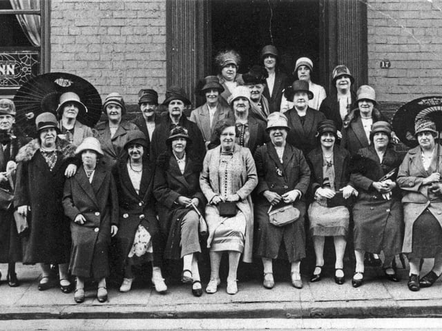 The New Inn on Town Street. This photo shows a group of women, circa 1920s, outside the pub which was adjacent to The Gang and opposite Old Field Yard and Appleyard Lane.