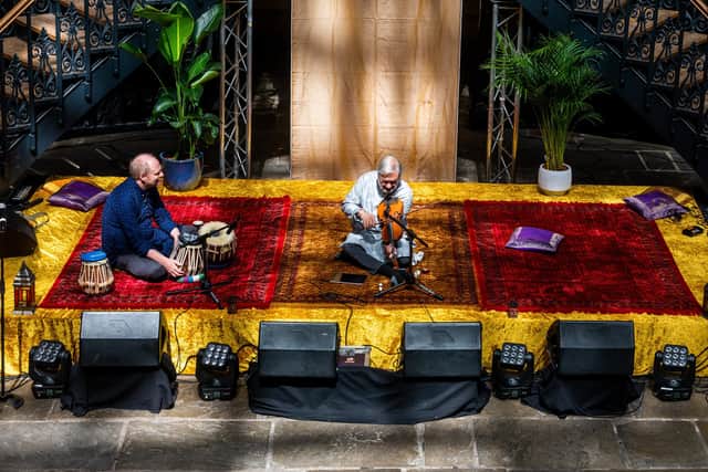 Musicians 'Smell The Coffee' John Ball (left) and Kamalbir Singh, one of the many acts playing during the 19 hour long festival (Photo: James Hardisty)