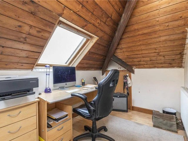 There is also ample parking, a car port and substantial matching garage with storage and topiaried southerly facing gardens to the rear.