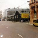 King Street looking towards East Parade in April 1979. The Hotel Metropole is in the foreground right. It stands on the site of the Fourth White Cloth Hall and opened on June 28, 1899. The Metropole was designed by architects Chorley and Connon in brick and terracotta. Quebec House on Quebec Street is the terracotta building in the background.