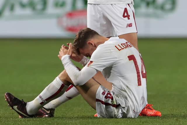 BERGAMO, ITALY - APRIL 24:  Bryan Cristante of AS Roma checks on teammate Diego Llorente as they go down during the Serie A match between Atalanta BC and AS Roma at Gewiss Stadium on April 24, 2023 in Bergamo, Italy. (Photo by Emilio Andreoli/Getty Images)