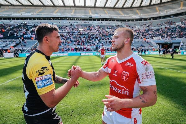 Salford's Oliver Partington shakes hands with Mikey Lewis, of Hull KR after the Red Devils kicked off Magic Weekend with a win.