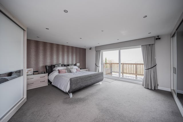 A large double bedroom with a balcony - and a view.