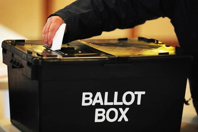 A voter placing a ballot paper in a ballot box at a polling station. PIC: Rui Vieira/PA Wire