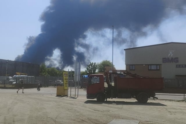 Pictures show black smoke billowing from the scene of the fire