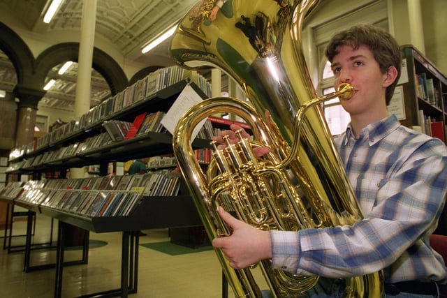 Gildersome teenager Edwin McClarty plays his tuba at Leeds Central Library as part of a music day in June 1996.