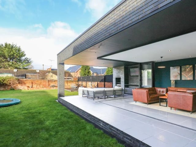 A view of the garden, complete with open fire and a barbecue.