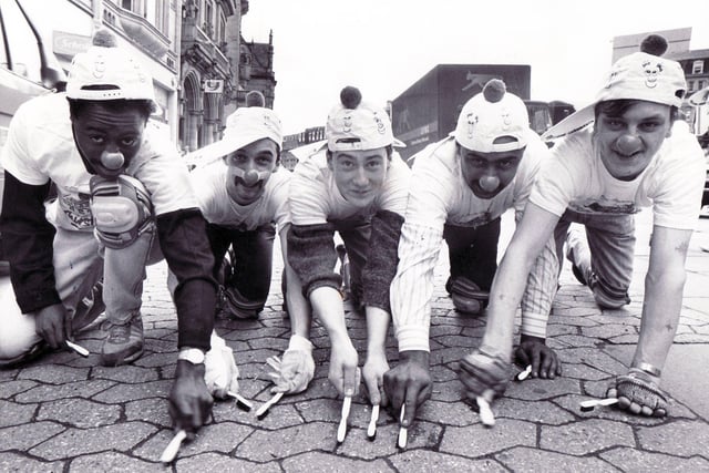 Locals from the Old Blue Bell sweep in Sheffield's Fargate with toothbrushes for Comic Relief in 1989