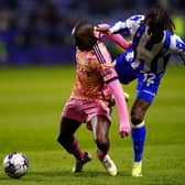 PRAISE: From Leeds United midfielder Glen Kamara, left, pictured battling it out with Sheffield Wednesday's Ike Ugbo in Friday night's Championship Yorkshire derby at Hillsborough. Photo by Mike Egerton/PA Wire.