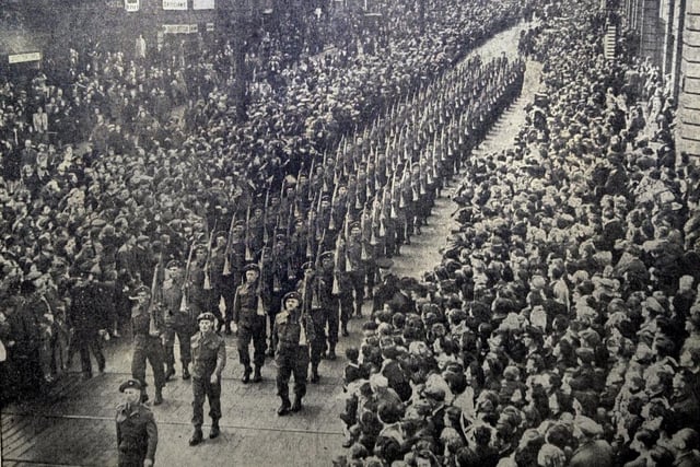 The Headrow in June 1945, as the Guard of Honour of the King's Own Yorkshire Light Infantry marched with bayonets fixed after the conferment of the Freedom of the City on the Regiment.
