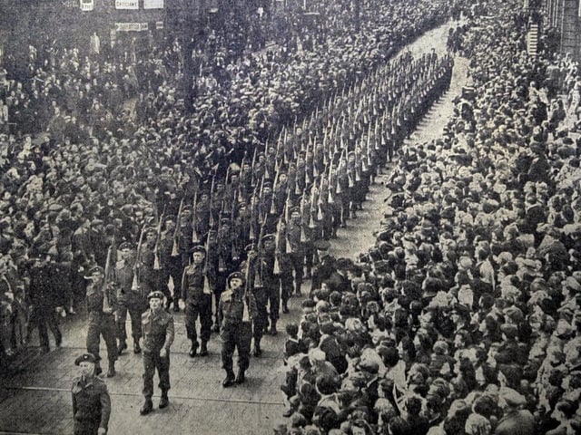 The Headrow in June 1945, as the Guard of Honour of the King's Own Yorkshire Light Infantry marched with bayonets fixed after the conferment of the Freedom of the City on the Regiment.