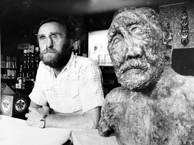 July 1976 and Ted Carroll, the TV and film extra with the 180 degree nose, is learning to live with himself at his pub in Ilkley. The new Ted, with the old nose, is a bronze bust modelled by a sculptress at Ilkley College. In fact Janet Bowler's Ted Carroll is even more rugged than the real thing. Ted let his nose go its own way after having it broken four times during his 12 years with Hunslet Rugby League Club. "She left it over the holidays with me to see if I could get used to it. People come up to it and order two pints", said Mr. Carroll, who with his wife, Beryl, ran the Rose and Crown, opposite Ilkley Parish Church.