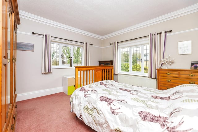 This double bedroom is light and bright thanks to two feature windows.