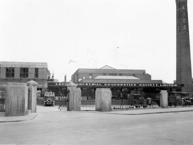 A wagon loaded with milk churns can be seen at the dairy premises of Leeds Industrial Co-operative Society Ltd in May 1936.