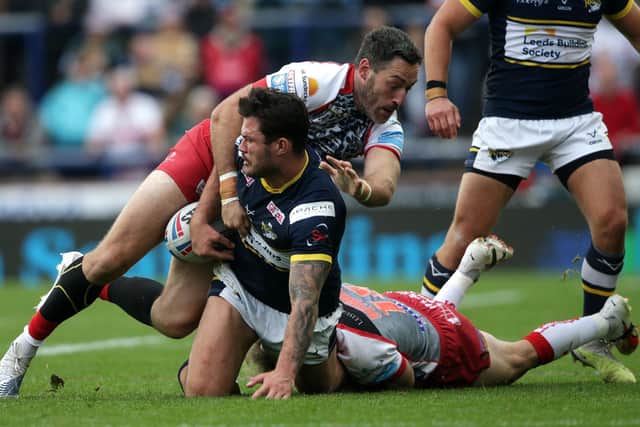 Rhinos' James Bentley is tackled by Ben Reynolds of Leigh. Picture by Ian Hodgson/PA Wire.