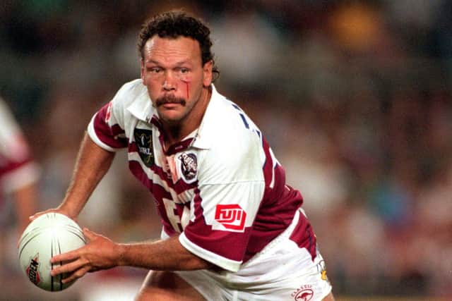 Cliff Lyons on the ball for Manly against Brisbane in 1998. Picture by Getty Images.