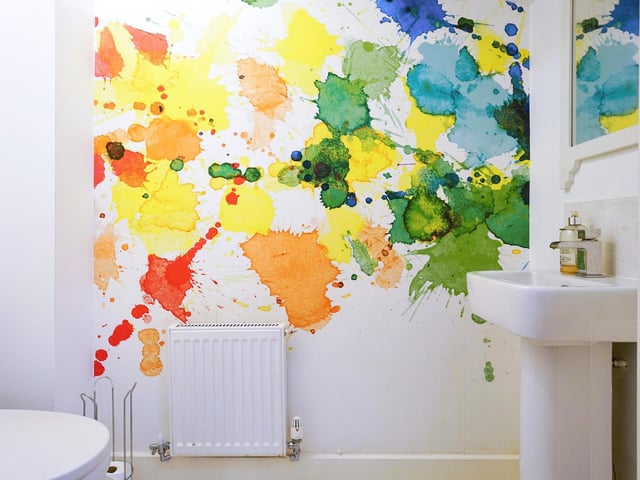 Downstairs also benefits from a separate toilet with artwork painted onto the walls.