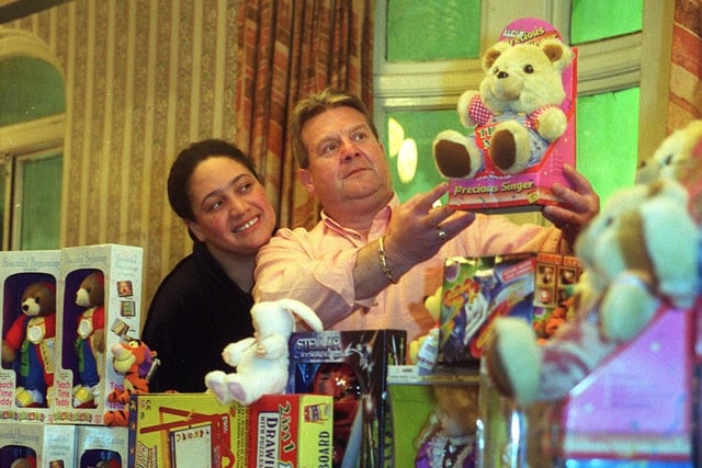 Three Legs pub Karaoke presenter 'Big Jackie' and landlord Geoff Rose display the toys for for donation to Leeds hospitals in December 1999.