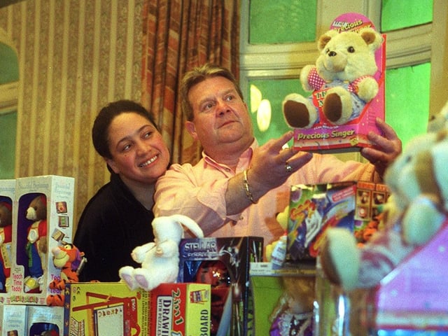 Three Legs pub Karaoke presenter 'Big Jackie' and landlord Geoff Rose display the toys for for donation to Leeds hospitals in December 1999.