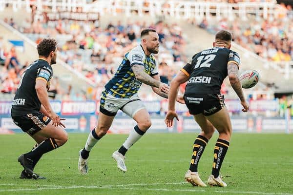 Blake Austin passes during Rhinos' Magic Weekend defeat by Castleford in June. Picture by Alex Whitehead/SWpix.com.