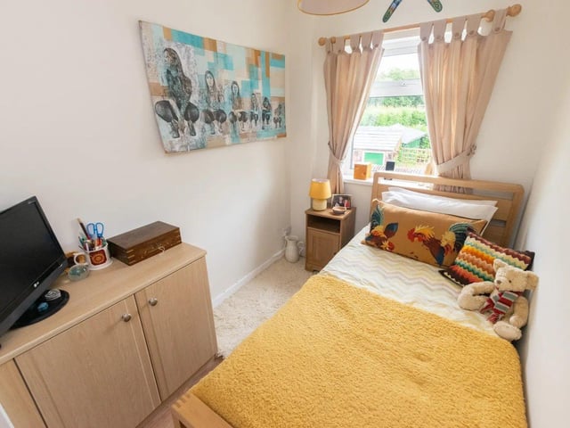The versatile second bedroom can serve as a guest room, home office or nursery.