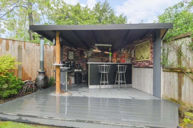 There is an impressive composite decking area, ideal for outdoor entertaining, a generous sized lawned area and a fantastic bar area which comes fully equipped with a pizza oven, log burner, BBQ and fridge.