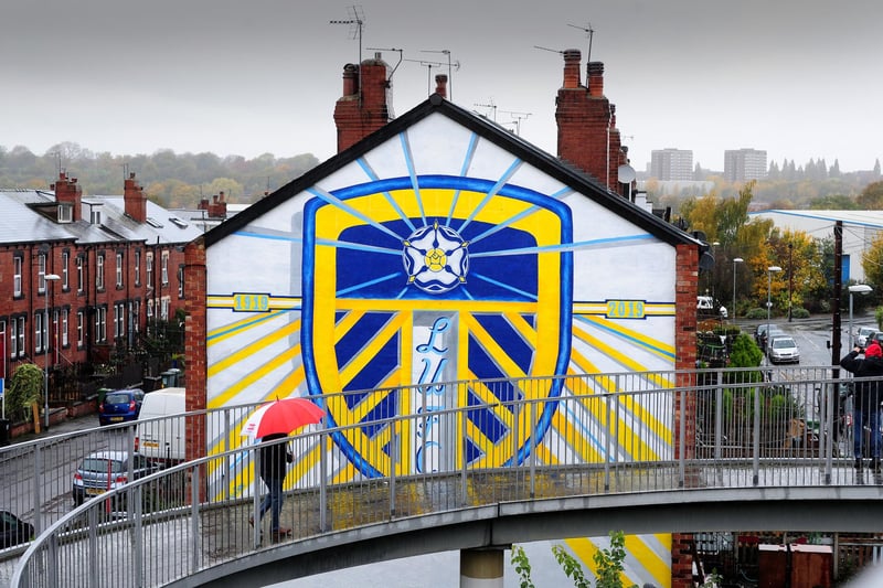 Painted by Shane Green, from Otley, the huge Leeds United badge artwork spans two end-terraces on Tilbury Mount in Holbeck, on the way to Elland Road stadium.