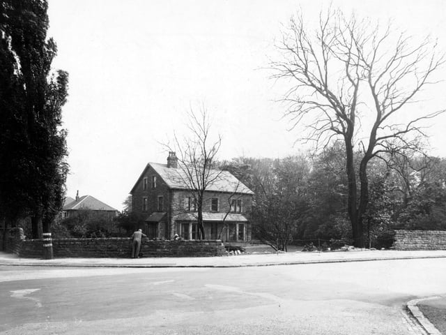 May 1948 and this view looks from Parkside Road to a large house at the corner of Stonegate Road (right) and Stainbeck Lane. The house, named Westgarth, is still standing and has more recently been a veterinary surgery for many years. The image shows damage to the perimeter wall and a man leaning over the wall appears to be repairing it.