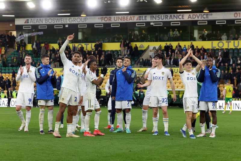 Leeds players celebrate in front of the bouncing away section at Carrow Road following the full-time whistle
