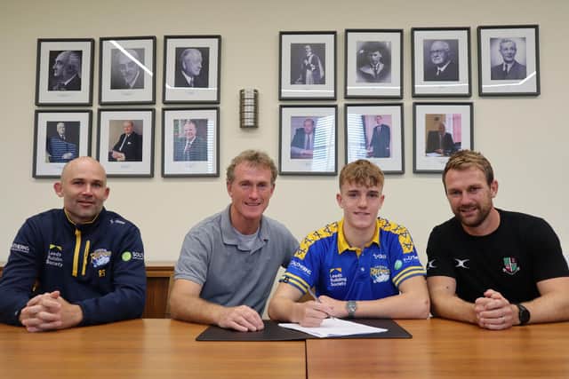 New signing Fergus McCormack with (left-right) Rhinos coach Rohan Smith, Dermott McCormack and Woodhouse Grove head of rugby Joe Bedford. Picture by Leeds Rhinos.