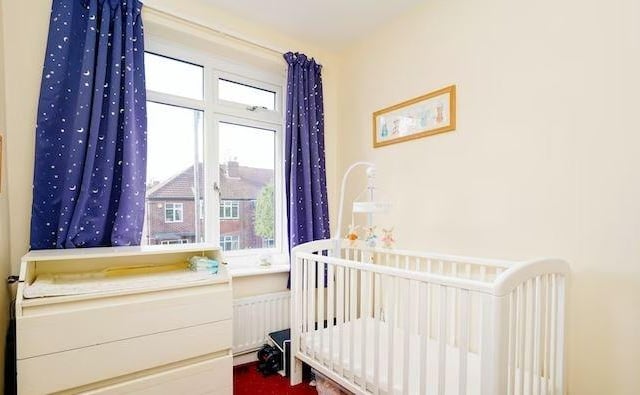 The smaller third bedroom offers perfect space for either a baby room or a home office area.