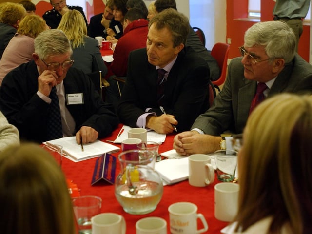 Former Prime Minister Tony Blair talking to people in Leeds about the issues of law and order on a visit to Fairfield Youth and Community Centre, Bramley, on December 1, 2003.