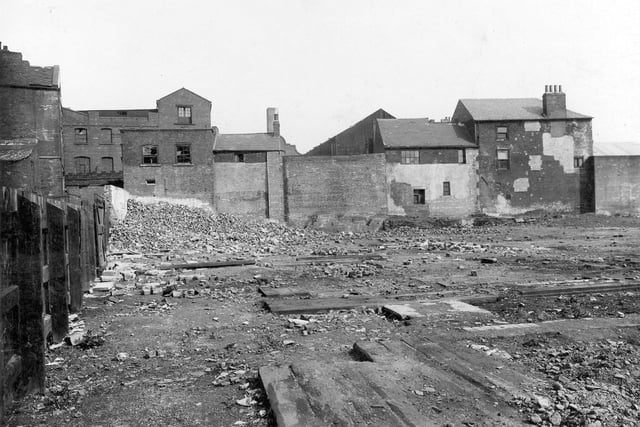 Waste land on Marsh Lane, East Street area, looking south east at back of Hudson's sawmills. View of area prior to beck covering work. Pictured in August 1936.