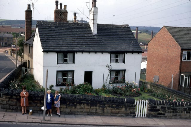Elland Road (foreground) at the junction with School Street (left) in July 1968. The white house on the corner, number 4 Elland Road, was demolished and the terrace below extended. A family named Ward had lived in the house for a number of years.