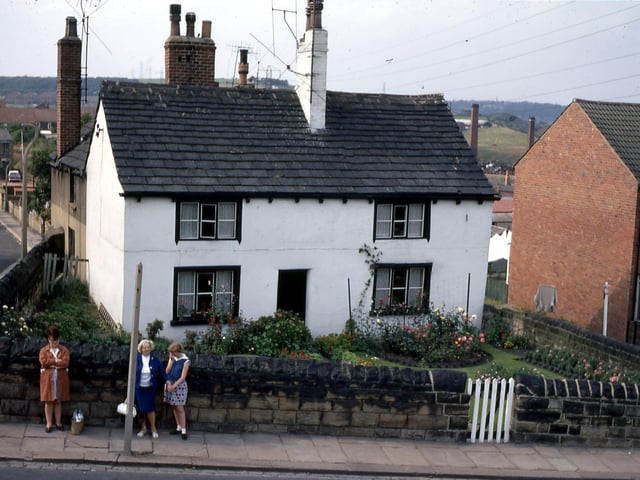 Elland Road (foreground) at the junction with School Street (left) in July 1968. The white house on the corner, number 4 Elland Road, was demolished and the terrace below extended. A family named Ward had lived in the house for a number of years.