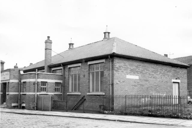 Gospel Hall, single storey brick building with a date stone for 1932. Joseph Street was to the right. Behind was Cariss Row. Pictured in April 1964.
