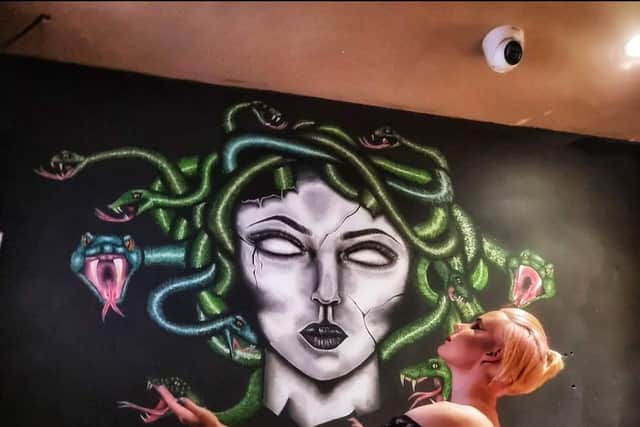 Chloe's Medusa mural in Indigo Alley
