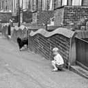 Young children playing in Howden Street, which ran between King's Road and Queen's Road with the backs of houses on Howden Terrace on the left and on Howden Place on the right.