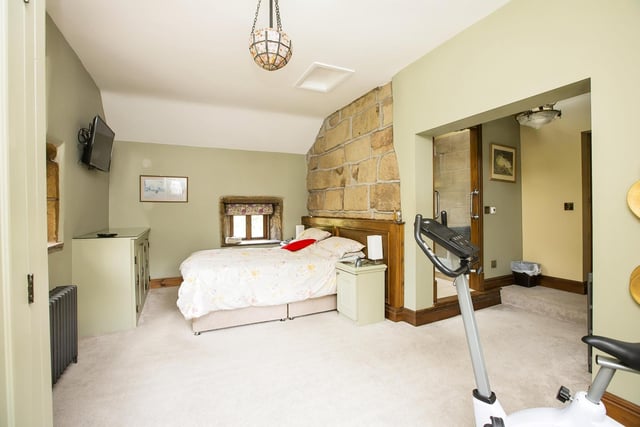 This double bedroom has open stonework to one wall.