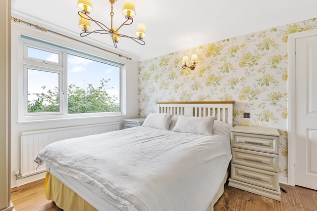 Upstairs, the spacious landing offers plenty of light and leads to four well-proportioned bedrooms, with the largest bedroom and second bedroom both benefiting from built-in wardrobes.
