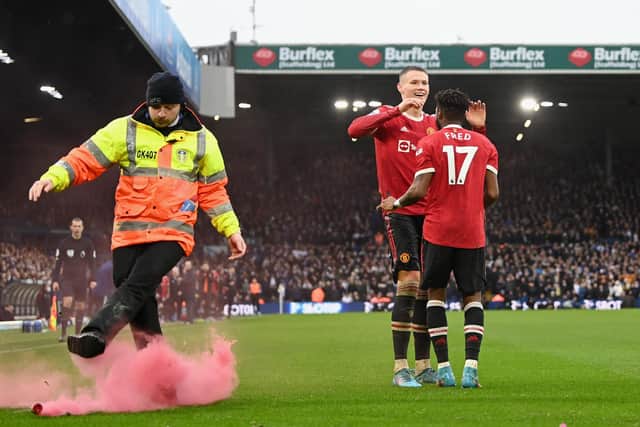 As well as the setting off of flares and smoke bombs, there were missiles such as coins thrown on to the pitch and towards fans of the opposition during the game. Image: Shaun Botterill/Getty Images