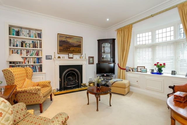 Stunning period fireplaces are central features in many of the apartment's rooms.