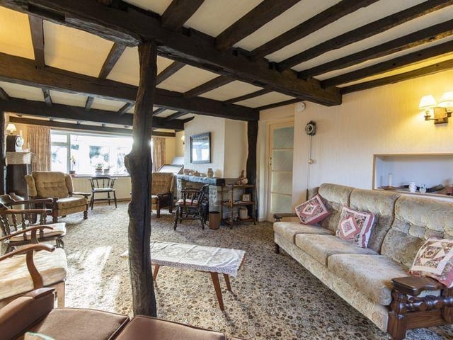 Spacious seating area with a feature fireplace in the living room.