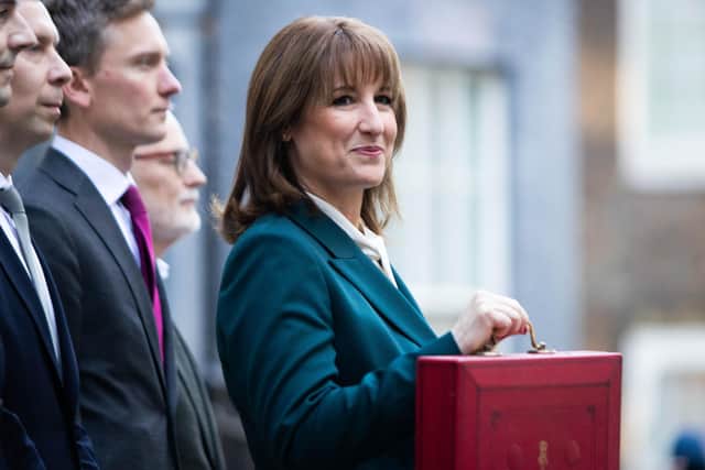 Chancellor of the Exchequer Rachel Reeves poses outside 11 Downing Street with her ministerial red box.