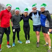 Runners after finishing the My Mito Mission Santa Dash 2024 in Stainland, Calderdale.
