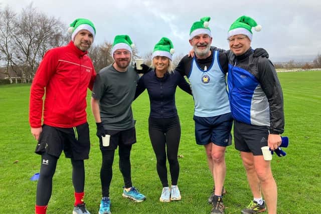 Runners after finishing the My Mito Mission Santa Dash 2024 in Stainland, Calderdale.