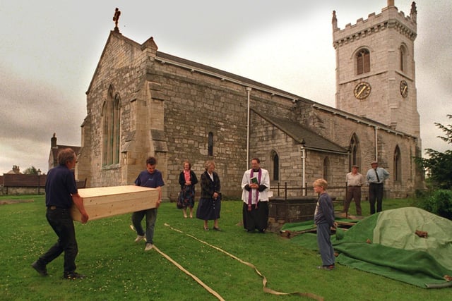 Final resting place. A cask containing the remains of 24 people who died in the Battle of Towton in 1461 on Palm Sunday is carried to the graveside at All Saints church  at Saxton near Tadcaster for a service and burial in July 1996.