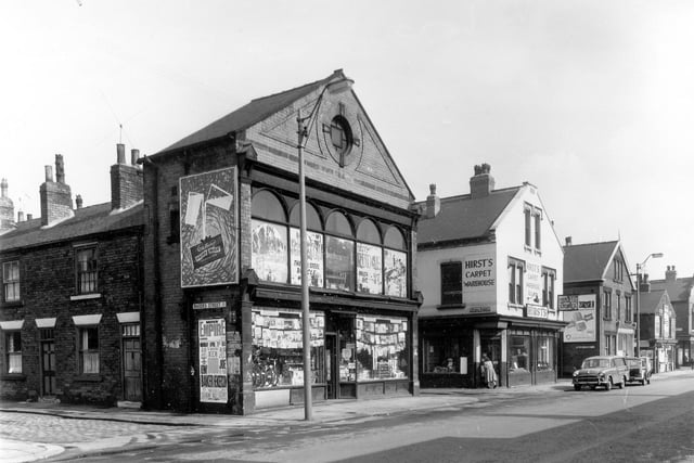 Rhodes Street is on the left edge of this photo from April 1959, with a poster for 'The Unpredictable Ken Dodd' at the Empire. Beeston Road follows to the right, a cycle dealer which also appears to be selling vinyl records and various other items, then Sykes Street and Hirst's Carpet Warehouse.