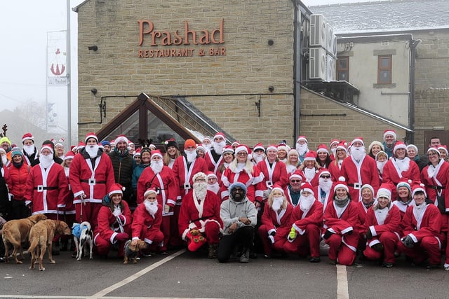 A group picture outside Prashad, the main sponsors of the Santa Stroll